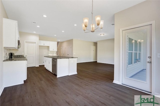 kitchen featuring dark wood-style flooring, a notable chandelier, white cabinets, open floor plan, and stainless steel appliances