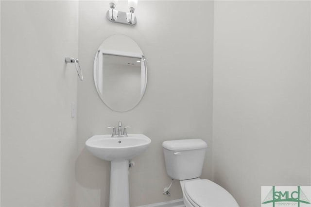 127 Lower Creek Dr, Richmond Hill, GA 31324 - bathroom with baseboards and toilet