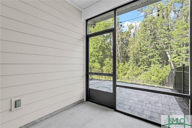 127 Lower Creek Dr, Richmond Hill, GA 31324 - doorway to outside featuring concrete floors and wooden walls