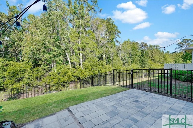 127 Lower Creek Dr, Richmond Hill, GA 31324 - view of patio / terrace with a wooded view and a fenced backyard