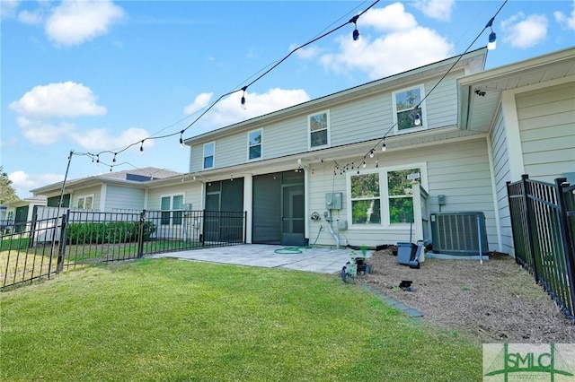 127 Lower Creek Dr, Richmond Hill, GA 31324 - back of property featuring central air condition unit, fence, a patio, and a lawn