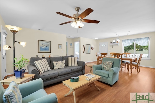 106 Pelican Ct, Tybee Island, GA 31328 - living area with baseboards, ceiling fan, and light wood-style flooring