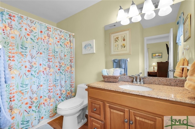 106 Pelican Ct, Tybee Island, GA 31328 - bathroom with vanity, visible vents, toilet, and a shower with curtain