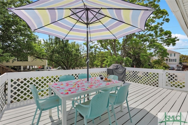 106 Pelican Ct, Tybee Island, GA 31328 - wooden terrace with outdoor dining area
