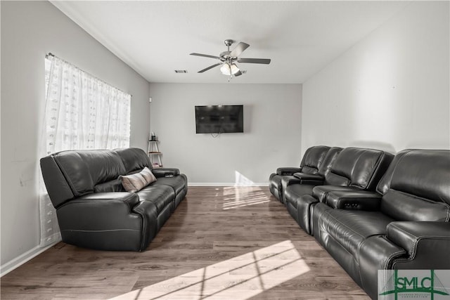 63 Springer Cir, Ludowici, GA 31316 - living area featuring baseboards, ceiling fan, wood finished floors, and visible vents