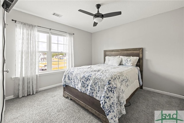 63 Springer Cir, Ludowici, GA 31316 - carpeted bedroom with baseboards, a ceiling fan, and visible vents