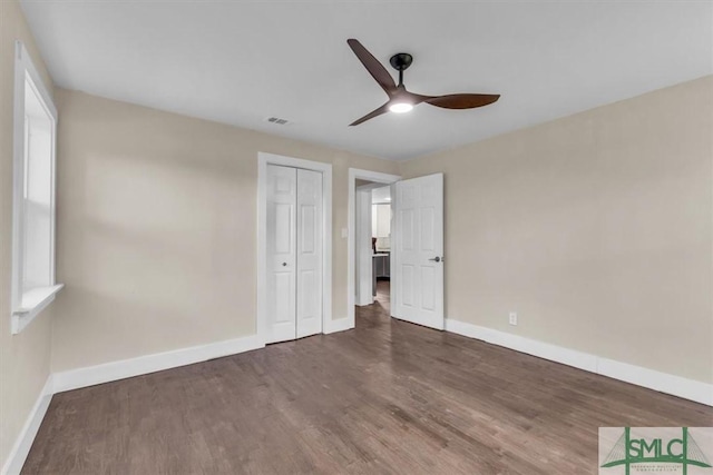 1107 E Derenne Ave, Savannah, GA 31406 - unfurnished bedroom featuring baseboards, wood finished floors, and visible vents