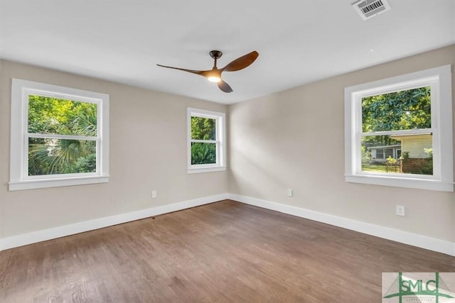 1107 E Derenne Ave, Savannah, GA 31406 - unfurnished room featuring baseboards, a ceiling fan, wood finished floors, and visible vents