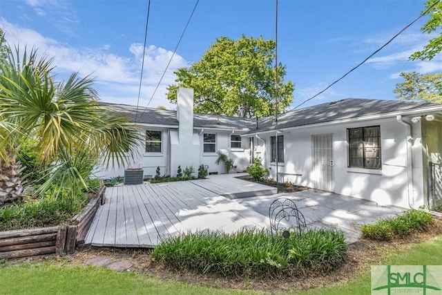 1107 E Derenne Ave, Savannah, GA 31406 - back of property featuring central AC unit, stucco siding, and a deck
