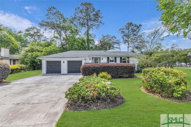 1107 E Derenne Ave, Savannah, GA 31406 - view of front of home with an attached garage, concrete driveway, and a front lawn