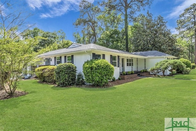 1107 E Derenne Ave, Savannah, GA 31406 - view of property exterior with a lawn and stucco siding