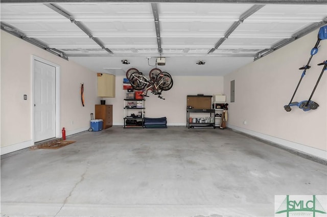 garage featuring baseboards and a garage door opener