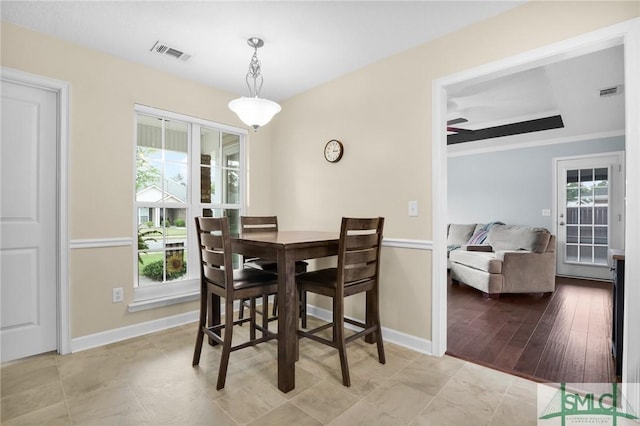 dining area with baseboards and visible vents