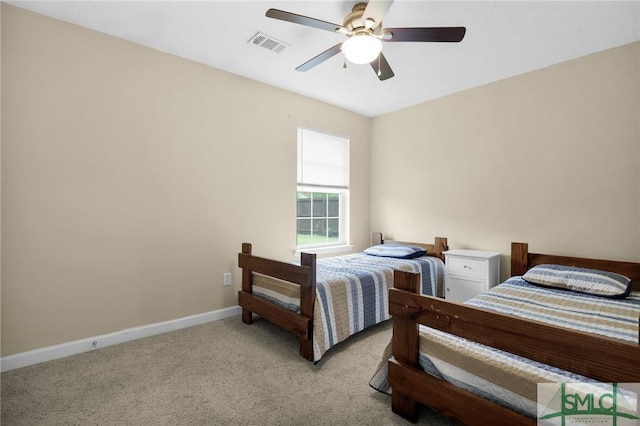 bedroom with carpet flooring, a ceiling fan, baseboards, and visible vents
