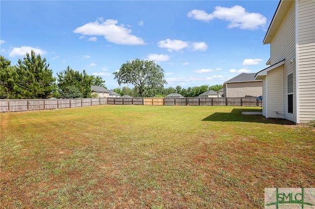 view of yard featuring a fenced backyard