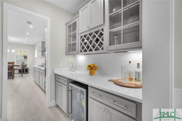 130 Canter Ct, Savannah, GA 31406 - indoor dry bar featuring wine cooler and decorative backsplash