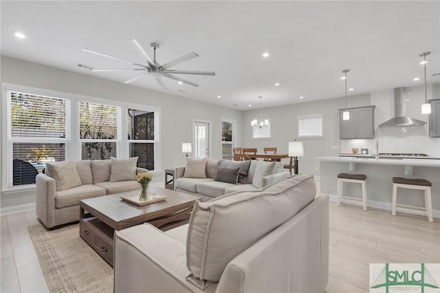 130 Canter Ct, Savannah, GA 31406 - living area featuring a chandelier, ceiling fan, recessed lighting, baseboards, and light wood-style floors