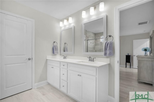 130 Canter Ct, Savannah, GA 31406 - bathroom with baseboards, a shower stall, and double vanity