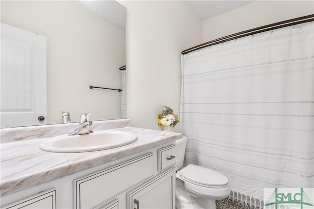 full bath featuring toilet and vanity