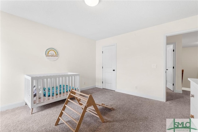 bedroom featuring carpet floors and baseboards