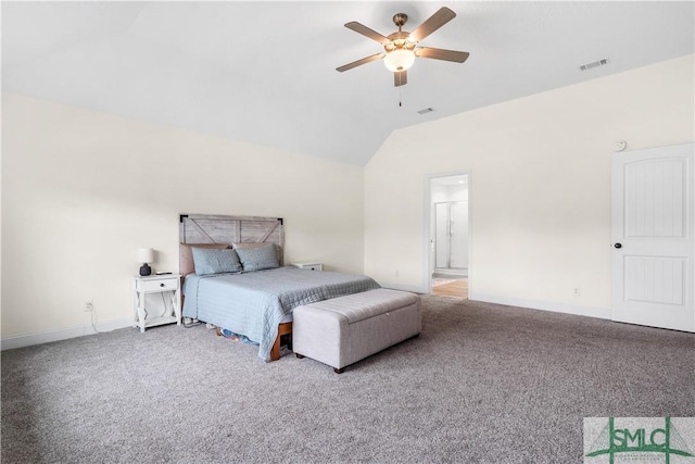 carpeted bedroom with a ceiling fan, baseboards, visible vents, and vaulted ceiling