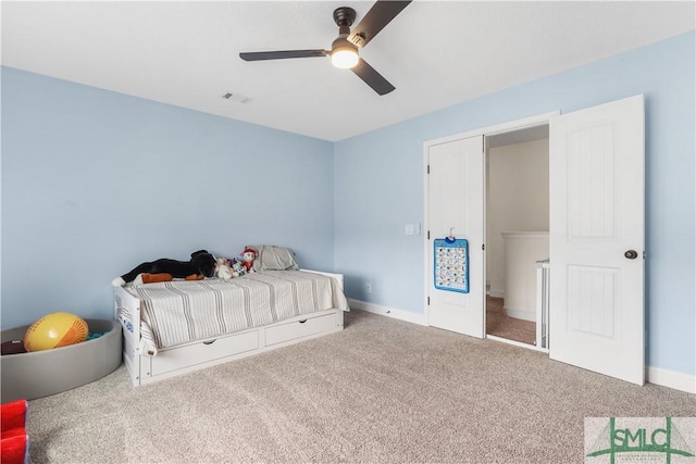 bedroom with visible vents, carpet, ceiling fan, and baseboards