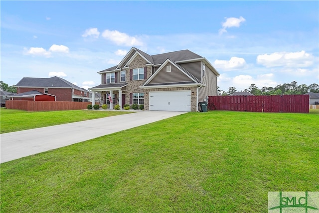 craftsman-style house featuring brick siding, a front lawn, fence, and concrete driveway