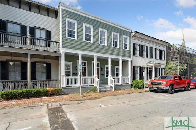 537 E Congress St, Savannah, GA 31401 - view of front of home with covered porch and uncovered parking