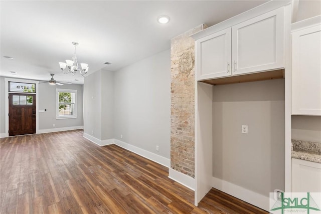 537 E Congress St, Savannah, GA 31401 - interior space featuring baseboards, ceiling fan with notable chandelier, wood finished floors, and visible vents