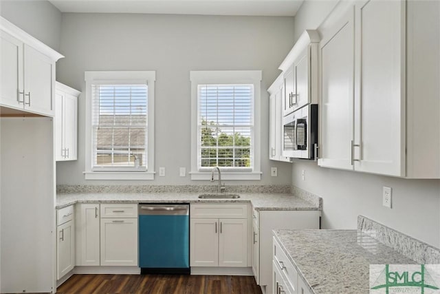 537 E Congress St, Savannah, GA 31401 - kitchen featuring stainless steel microwave, a wealth of natural light, a sink, and dishwasher