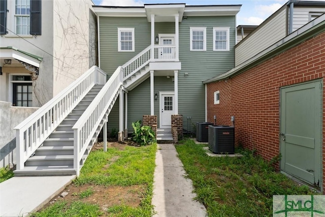 537 E Congress St, Savannah, GA 31401 - rear view of house featuring stairs and cooling unit
