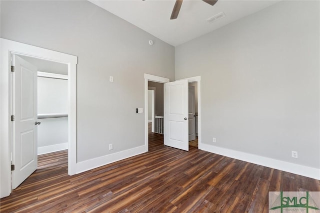 537 E Congress St, Savannah, GA 31401 - unfurnished bedroom with baseboards, wood finished floors, and visible vents