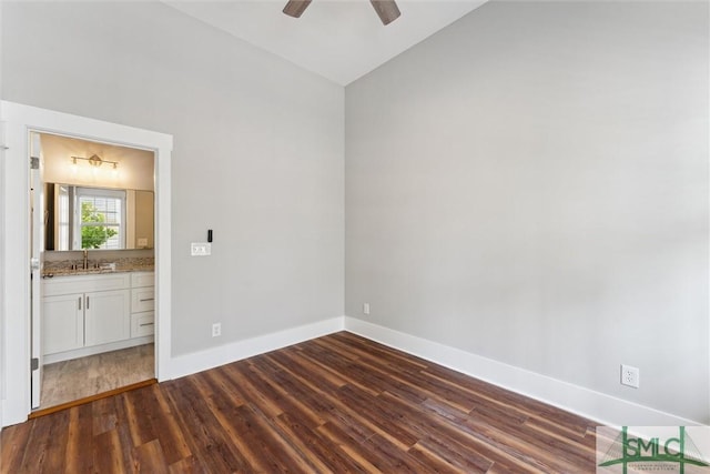 537 E Congress St, Savannah, GA 31401 - interior space with a ceiling fan, lofted ceiling, baseboards, a sink, and dark wood finished floors