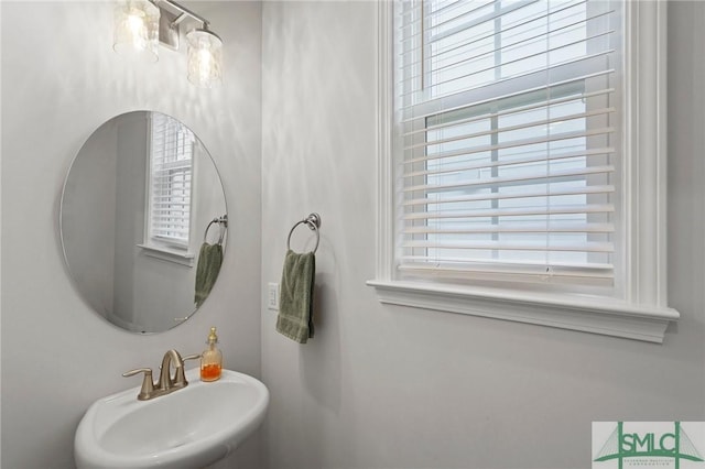bathroom featuring a sink and a healthy amount of sunlight