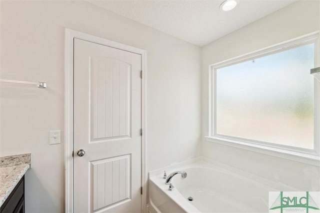 4 Rimes Ave SE, Ludowici, GA 31316 - bathroom with vanity and a garden tub