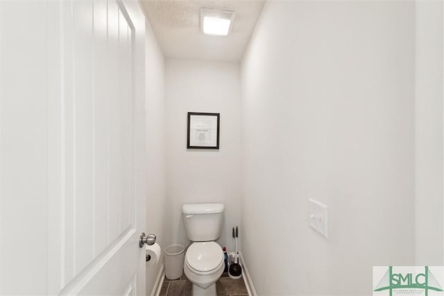 4 Rimes Ave SE, Ludowici, GA 31316 - bathroom featuring toilet and baseboards