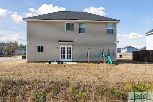 4 Rimes Ave SE, Ludowici, GA 31316 - back of property featuring fence, french doors, and a playground