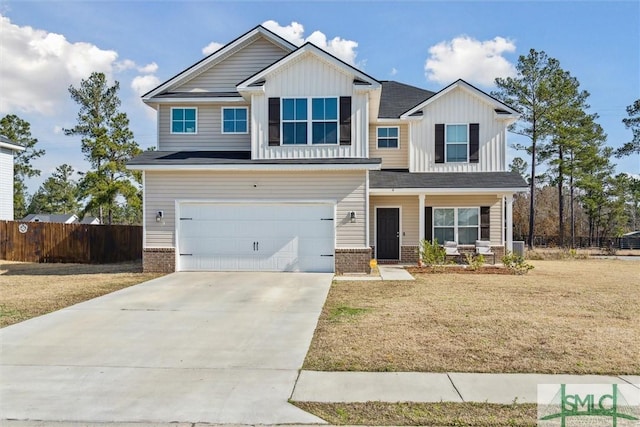4 Rimes Ave SE, Ludowici, GA 31316 - craftsman-style house with fence, covered porch, board and batten siding, an attached garage, and driveway