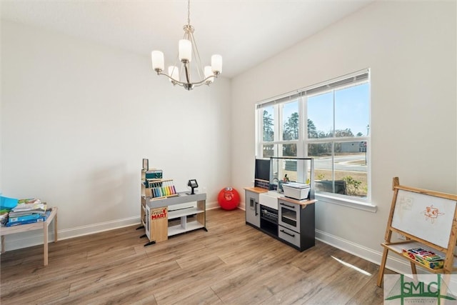 4 Rimes Ave SE, Ludowici, GA 31316 - game room featuring an inviting chandelier, baseboards, and light wood finished floors