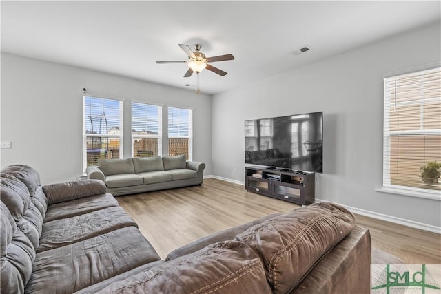 227 Flagler Dr, Savannah, GA 31419 - living room with visible vents, baseboards, ceiling fan, and wood finished floors