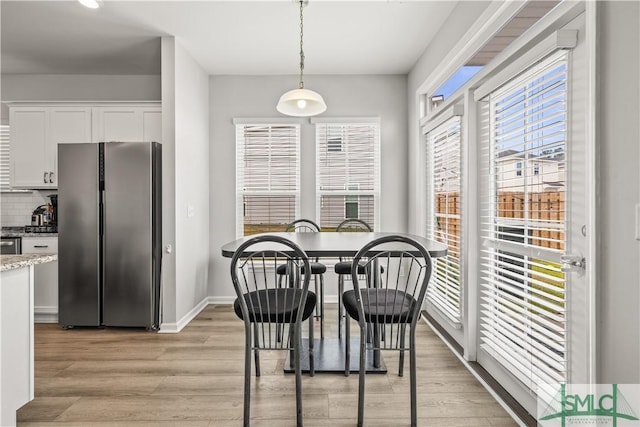 227 Flagler Dr, Savannah, GA 31419 - dining room with baseboards and light wood-style flooring