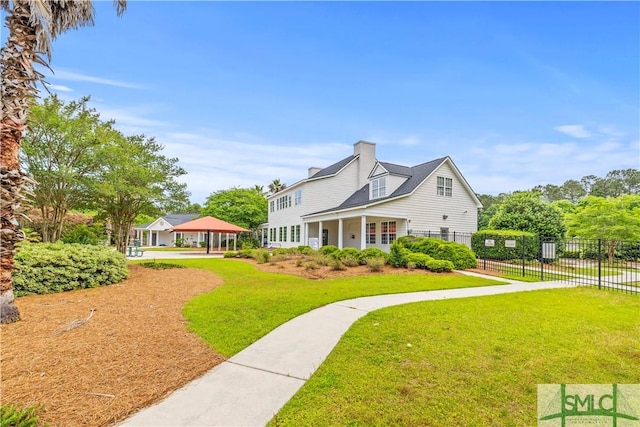 227 Flagler Dr, Savannah, GA 31419 - exterior space with a yard, a gazebo, fence, and a chimney