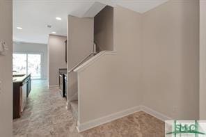staircase with baseboards and recessed lighting