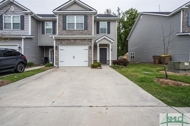 270 Kepler Loop, Richmond Hill, GA 31324 - view of property featuring brick siding, concrete driveway, a front lawn, and an attached garage