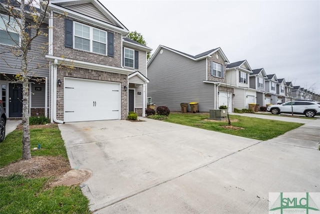 270 Kepler Loop, Richmond Hill, GA 31324 - view of front of home featuring brick siding, concrete driveway, an attached garage, and a residential view