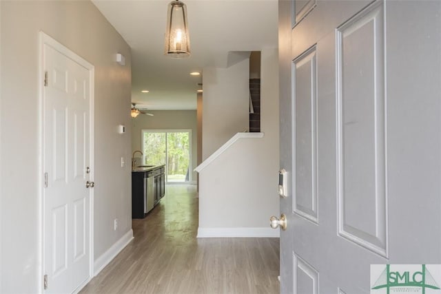 270 Kepler Loop, Richmond Hill, GA 31324 - entryway featuring light wood-style floors, baseboards, a ceiling fan, and stairway