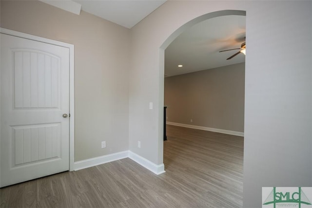 270 Kepler Loop, Richmond Hill, GA 31324 - spare room featuring a ceiling fan, arched walkways, wood finished floors, baseboards, and recessed lighting