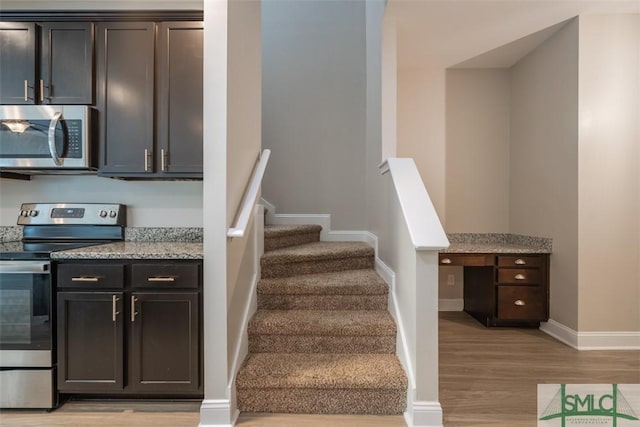 270 Kepler Loop, Richmond Hill, GA 31324 - stairs featuring wood finished floors and baseboards