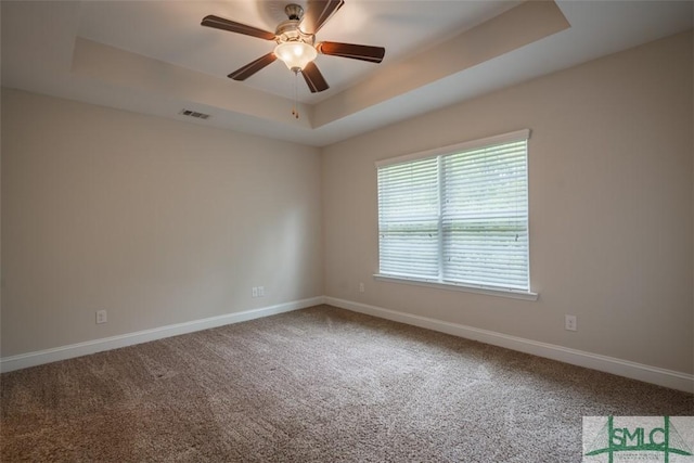 270 Kepler Loop, Richmond Hill, GA 31324 - empty room featuring a tray ceiling, carpet flooring, baseboards, and ceiling fan