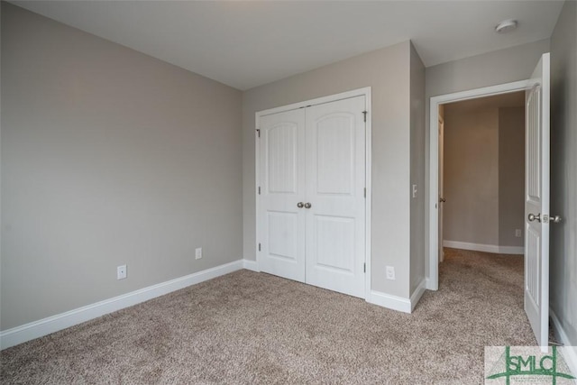 270 Kepler Loop, Richmond Hill, GA 31324 - unfurnished bedroom featuring carpet floors, a closet, and baseboards